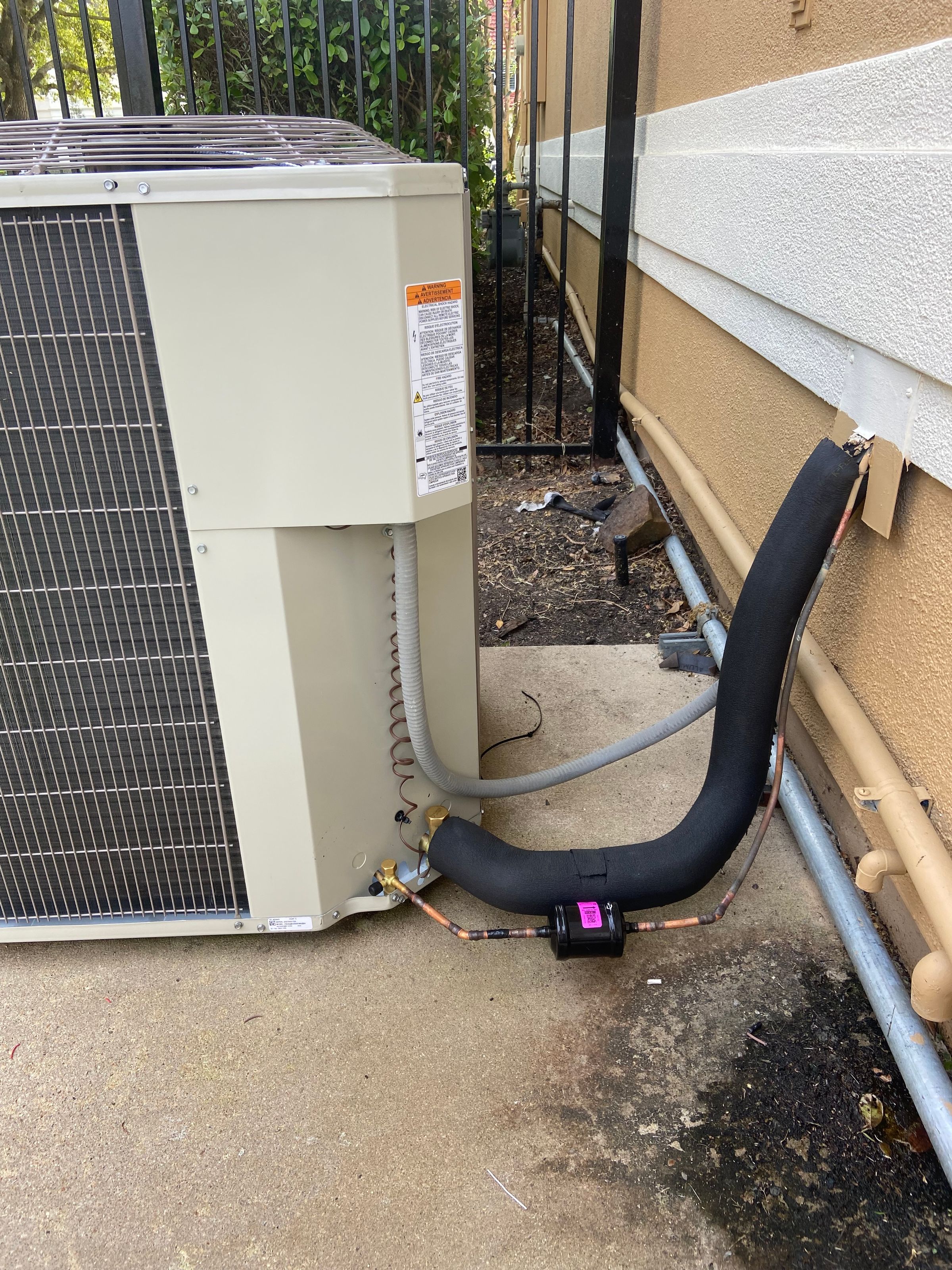 Outdoor air conditioning system from the Houston Innovations A/C website