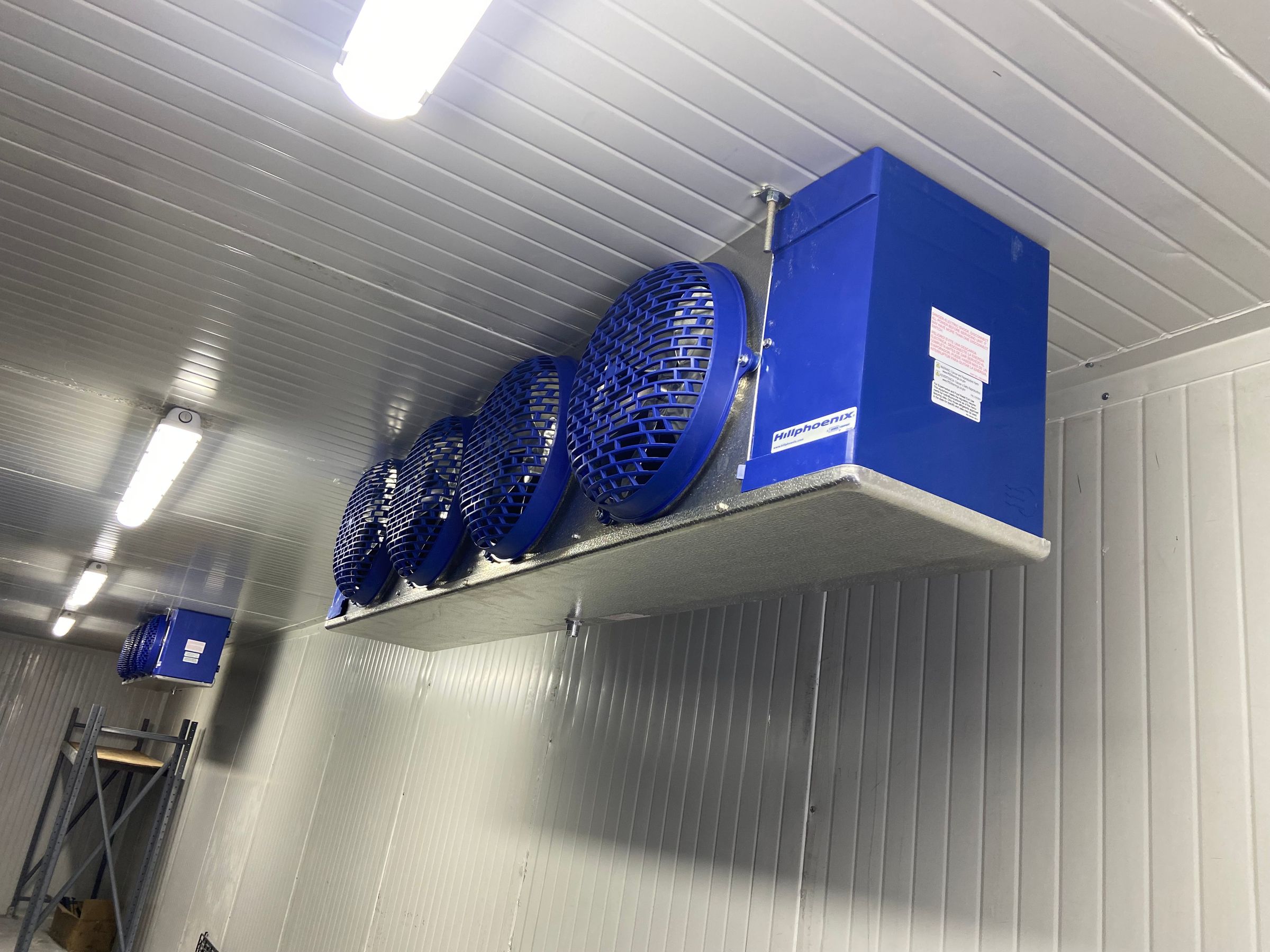 Commercial refrigeration equipment with blue cooling fans